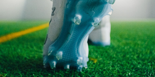 Choosing the Right Lacrosse Cleats for Different Field Conditions: Turf vs. Grass